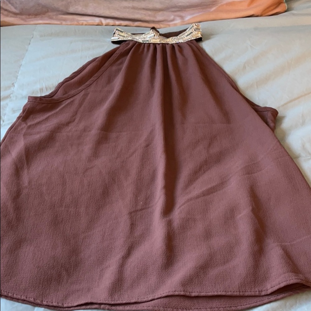Mauve sleeveless blouse with rhinestone neck